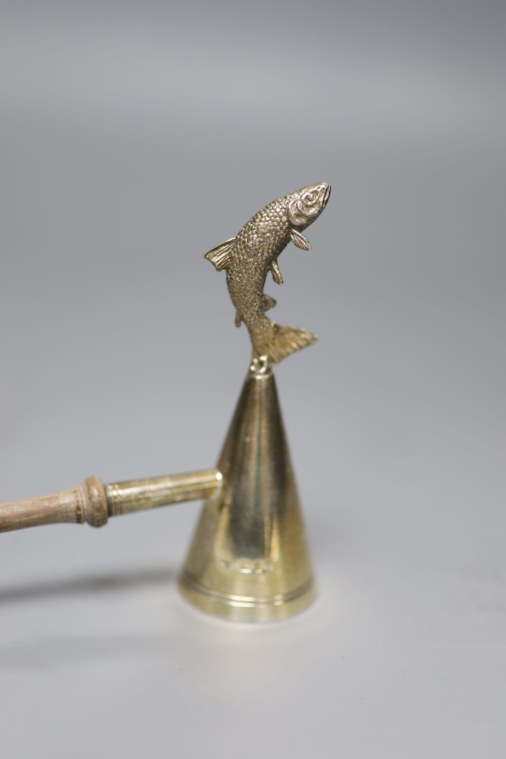 A George III ivory-handled silver cheese scoop, London, 1811, 26.4cm, a silver-handled ivory page turner and a modern silver snuffer